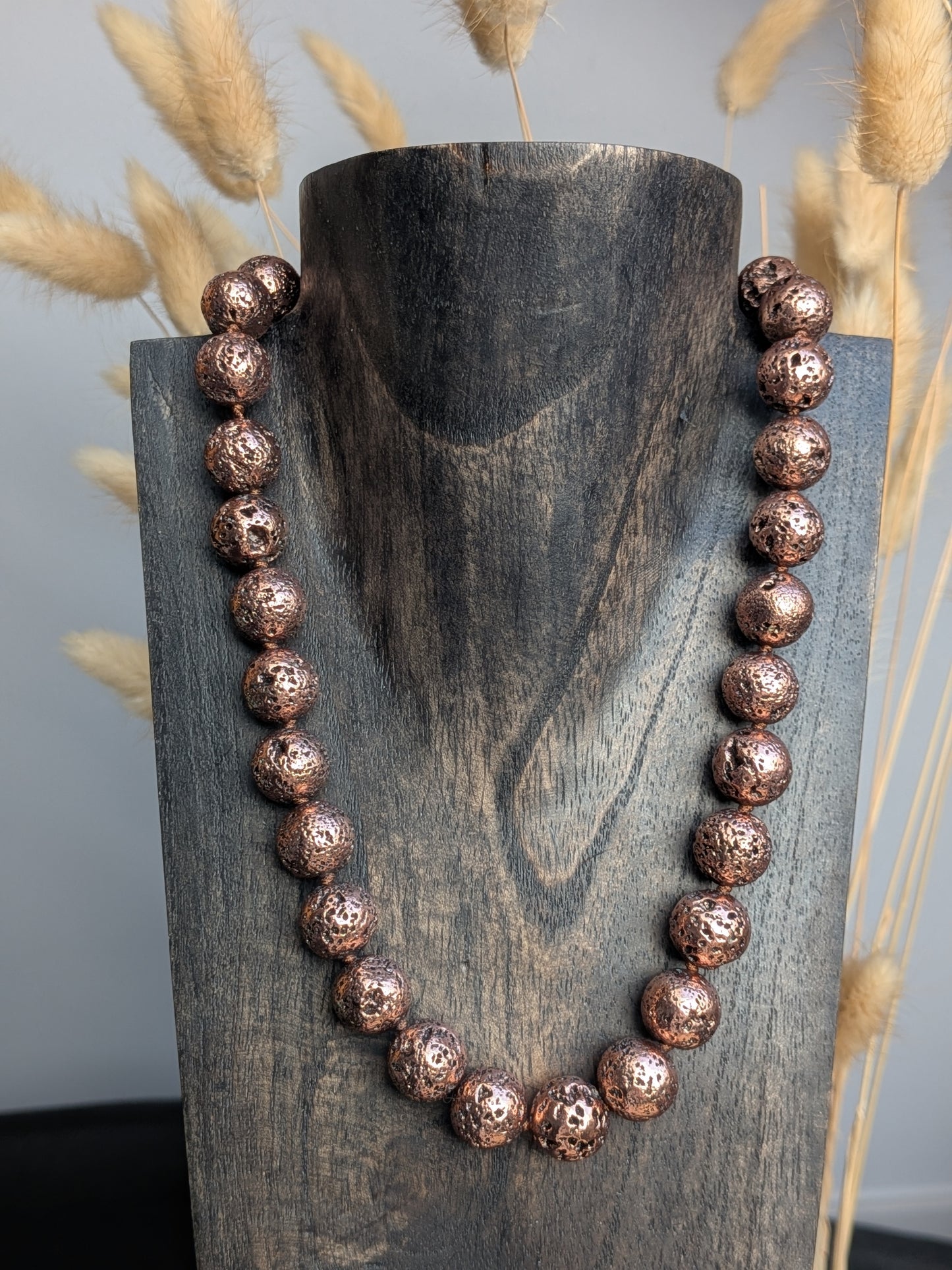 Collier boules pierre de lave cuivrée