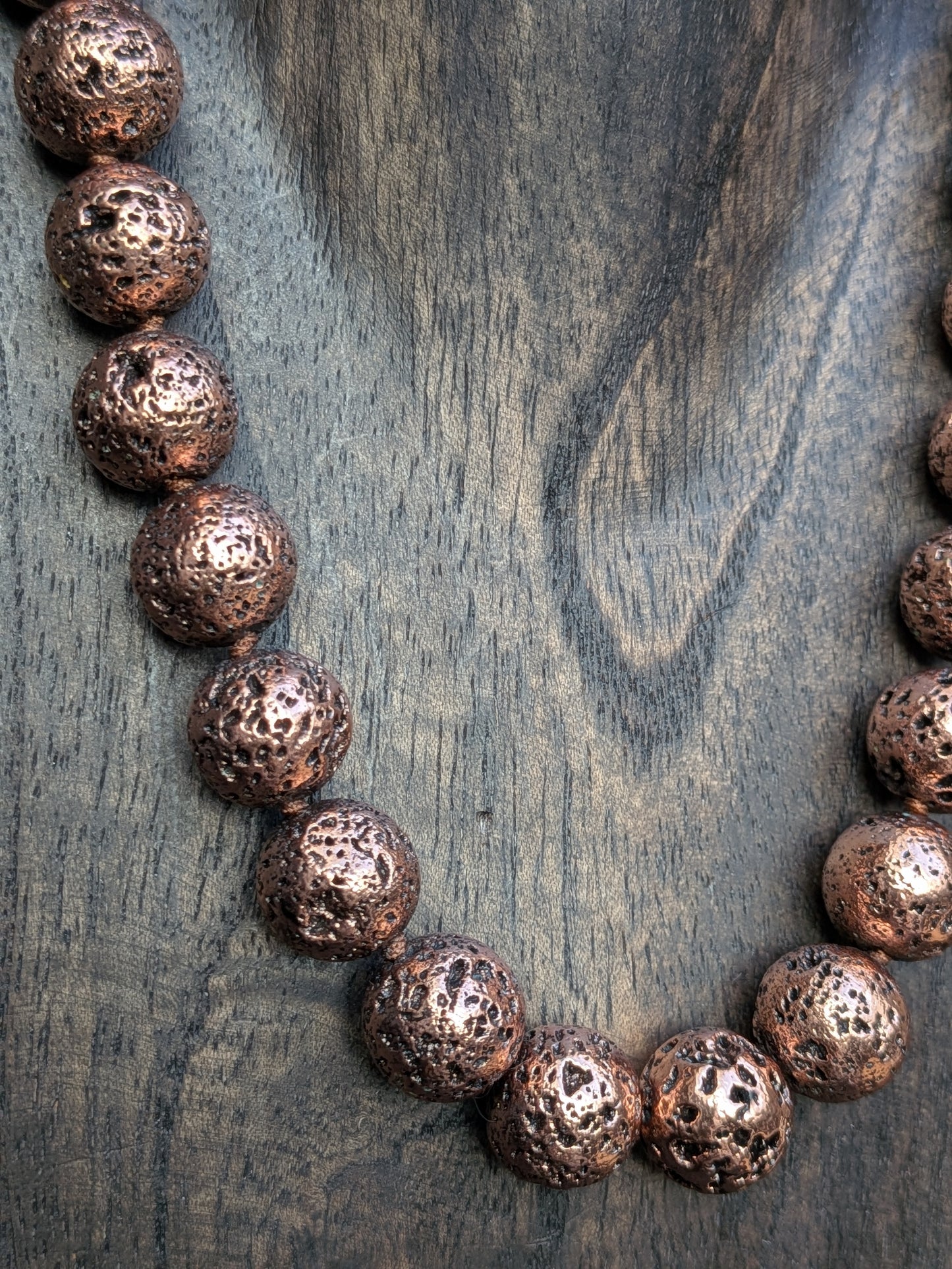 Collier boules pierre de lave cuivrée